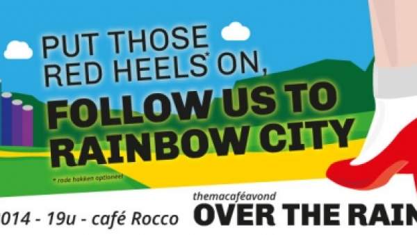 Promo-affiche van themacaféavond OVER THE RAINBOW: een graphic van iemands voeten in witte sokken en rode hakken op een geel pad richting een kasteel in regenboogkleren wat in de verte, met in het midden de woorden 'Put those red heels on, follow us to rainbow city' in zwarte letters. Links onderaan staat het logo van het Holebihuis, en op een witte achtergrond staat onderaan in zwarte letters '9 mei 2014 - 19u - café Rocco, themacaféavond OVER THE RAINBOW'